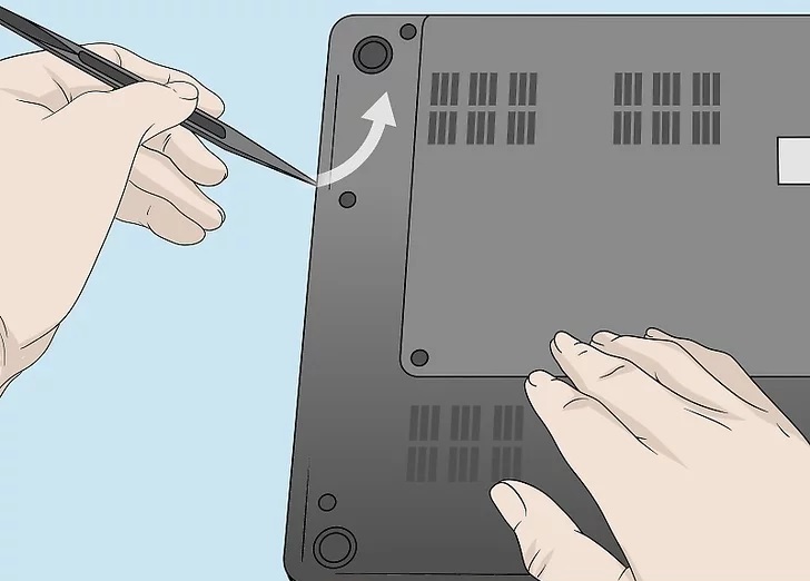 4. Use your fingernail or a plastic pry tool to detach the laptop bottom panel